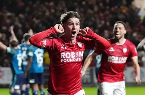 Bristol City's George Earthy smiles and holds his hands to his ears as he runs away to celebrate a goal against Middlesbrough at Ashton Gate