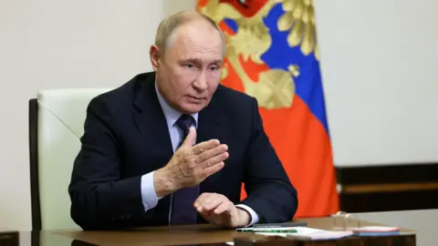 Russian President Vladimir Putin chairing a meeting