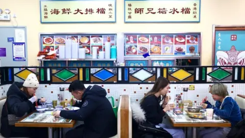 Getty Images Customers dine at a restaurant as Beijing no longer requires people to show their negative nucleic acid testing results before entering public places on December 21, 2022