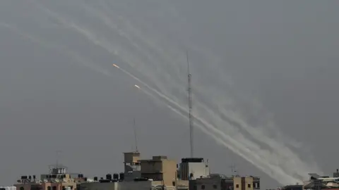 Getty Images Rockets firing into air from Gaza apartments