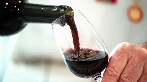 Getty Images Red wine poured into a glass