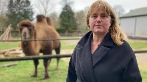 Claudia Roberts and a camel in the background