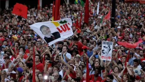 Reuters Supporters of former Brazilian President Luiz Inacio Lula da Silva attend a rally in support of Lula da Silva candidacy to the 2018 presidential race, in Porto Alegre, Brazil January 23, 2018