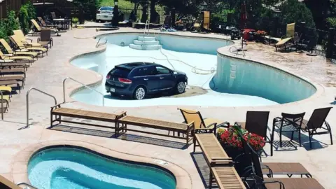 Instagram/fredd1e A car sitting in the bottom of an empty swimming pool in Colorado Springs - 3 July 2017