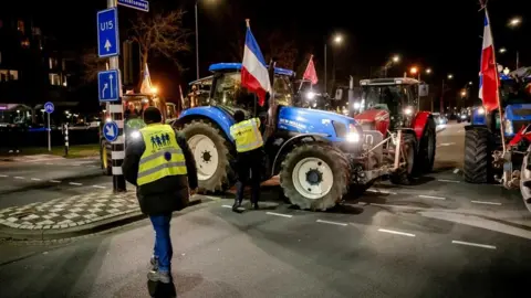 JEROEN JUMELET/EPA-EFE/REX/Shutterstock Tractors at the Provincial House of North Brabant during a demonstration in Den Bosch, the Netherlands, 14 March 2023