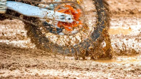 Getty Images Motorbike tyre in the mud