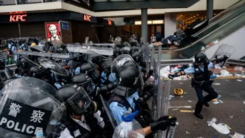 Getty Images A police officer throws a teargas canister during a protest on June 12, 2019 in Hong Kong China