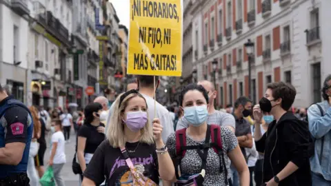 Getty Images People protesting with banners during a demonstration against the new rise in the electricity bill approved by the government, in Madrid, Spain, on June 5, 2021