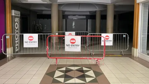Barriers with no entry signs in a shopping centre
