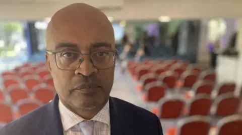 Paul Rees standing in the meeting room at a hotel in Nottingham after addressing harmed families who are part of the review into NHS maternity failings in the city