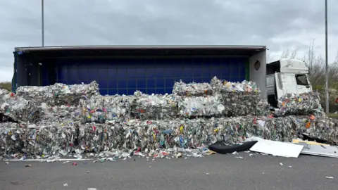 Lorry with load shed on the A46.