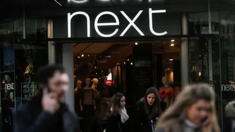 Reuters Four people walk out of the next store 