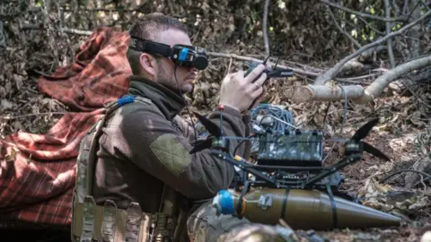 Getty Images A Ukrainian soldier flying a drone
