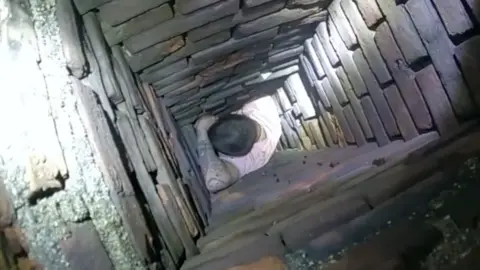 Man stuck trying to hide in a chimney