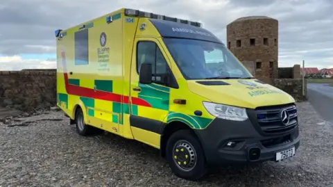 BBC Guernsey ambulance by coast