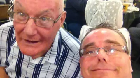 Wayne Hatton Wayne Hatton and his dad doing a selfie and both smiling 