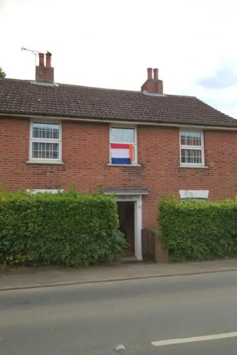 Emily Knight/PA Wire Gerda Newsham's house displaying a Netherlands flag in the middle upstairs window next to two other windows