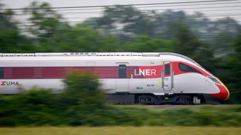 A stock image of a moving LNER training pictured on tracks in the countryside