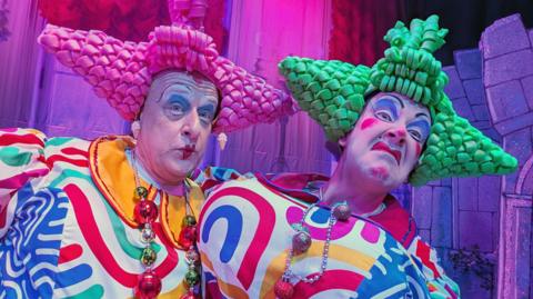 An image from the pantomime stage featuring colorful costumes and lively characters.