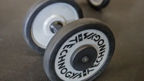 SAMEER AL-DOUMY/GETTY Dumbbells