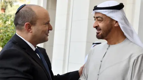 Reuters Israeli Prime Minister Naftali Bennett shakes hands with Abu Dhabi Crown Prince Sheikh Mohammed bin Zayed in the United Arab Emirates (13 November 2011)