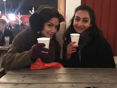 Victoria Spencer Ruchira Sharma (right) with a friend at a Christmas market