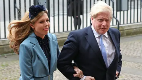 Yui Mok/PA Wire Prime Minister Boris Johnson and his fiancee Carrie Symonds attended the service