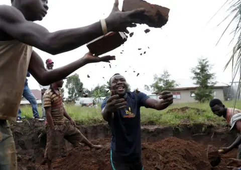 Goran Tomasevic / Reuters Men make bricks in Bunia, Ituri province, eastern Democratic Republic of Congo