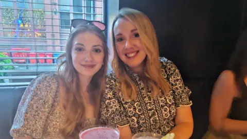 A photo of Anja Wilson, who had blonde hair and brown eyes, with her mum Carly, who also has blonde hair and brown eyes.