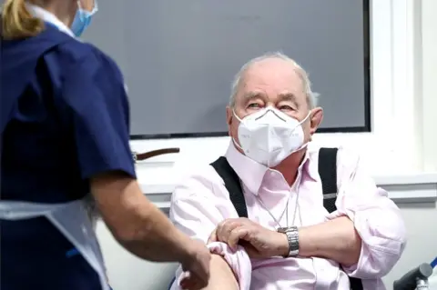 PA Media man receiving jab