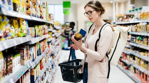 Getty Images Woman shopping in supermarket