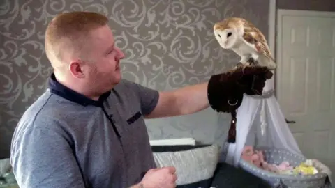 Scott Gavin holding his barn owl