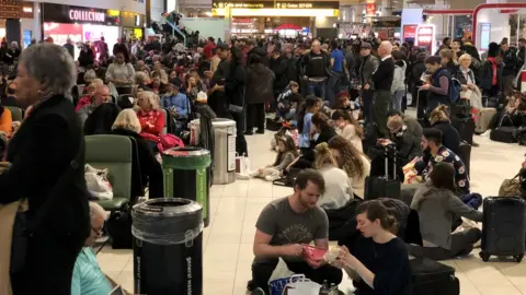 Getty Images Passengers at Gatwick airport disrupted by drone incidents at