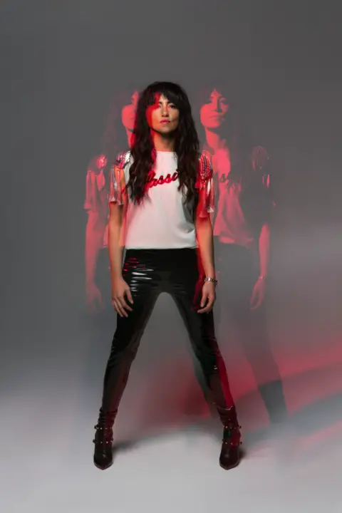 KT Tunstall Popstar KT Tunstall in a wide-legged pose.