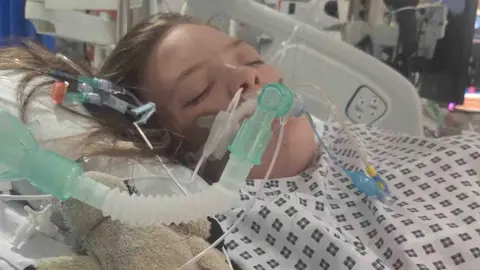 Natalie-Anne Rowlett Felicity-Jo is on an incubator in hospital in this image