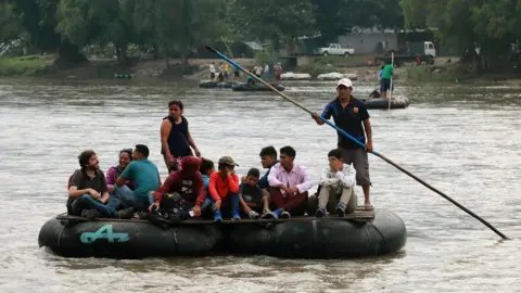 AFP/Getty Images Locals and Central American migrants use a makeshift raft across the Suchiate river from Tecun Uman in Guatemala, to Ciudad Hidalgo in Chiapas State, Mexico, on June 11, 2019