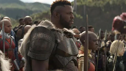 Disney/Marvel Winston Duke with Danai Gurira in Avengers: Infinity War