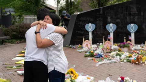 Getty Images Mourners at a makeshift vigil