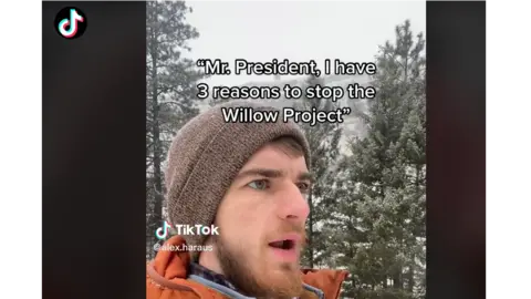 TikTok/Alex Haraus TikToker Alex Haraus stands in forest with snow all around. Caption reads "Mr President. I have 3 reasons to stop the Willow Project".