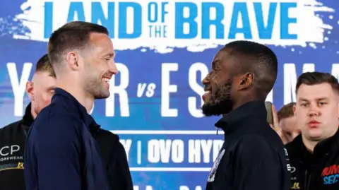 Josh Taylor (left) takes on Ekow Essuman in Glasgow on Saturday