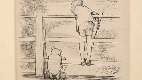 PA An illustration titled "For a long time they looked at the river beneath them…" from The House At Pooh Corner which sold at auction in 2014 for more than £300,000