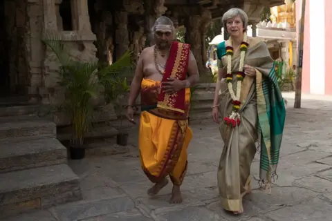 Getty Images Theresa May is welcomed to the Sri Someshwara Temple in Bangalore on 8 November 2016