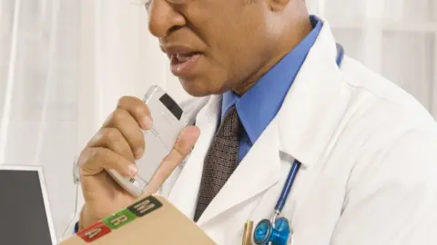 Getty Images Doctor with voice recorder