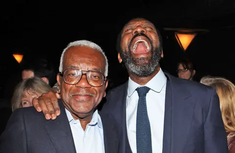 Getty Images Sir Tevor McDonald meets actor Lenny Henry following his performance on press night of 'Fences' at the Duchess Theatre in London