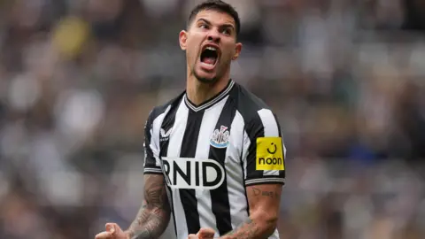 Newcastle's  Bruno Guimaraes reacts after his side score against Tottenham in the Premier League