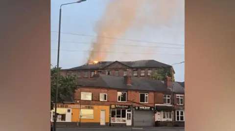 A disused building on fire.