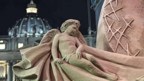 EPA The Vatican nativity Scene, sculpted from sand, is inaugurated at St Peter's Square in Vatican City on 7 December 2018