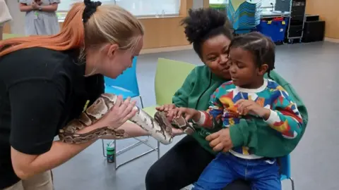 Sense Natalie and her eight-year-old son Azuriah at charity Sense in Selly Oak.