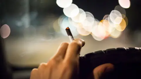 Getty Images Smoking at the wheel