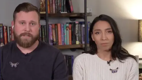Sky Roberts, brother of Virginia Giuffre, wearing long sleeve black top and butterfly broach